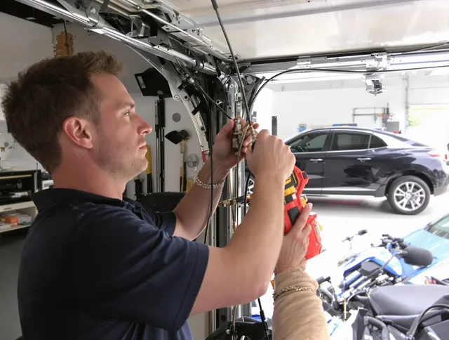 Plantation Garage Door Repair safety certified technician performing cable replacement in Plantation