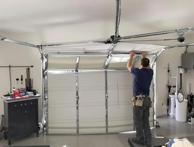 Plantation Garage Door Repair specialist performing precise section replacement on Plantation garage door