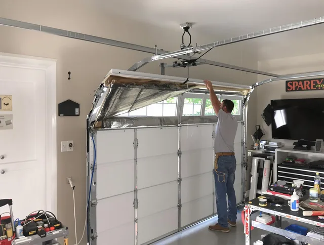 Garage door section replacement by Plantation Garage Door Repair in Plantation
