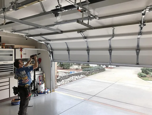 Garage door track repair service by Plantation Garage Door Repair in Plantation